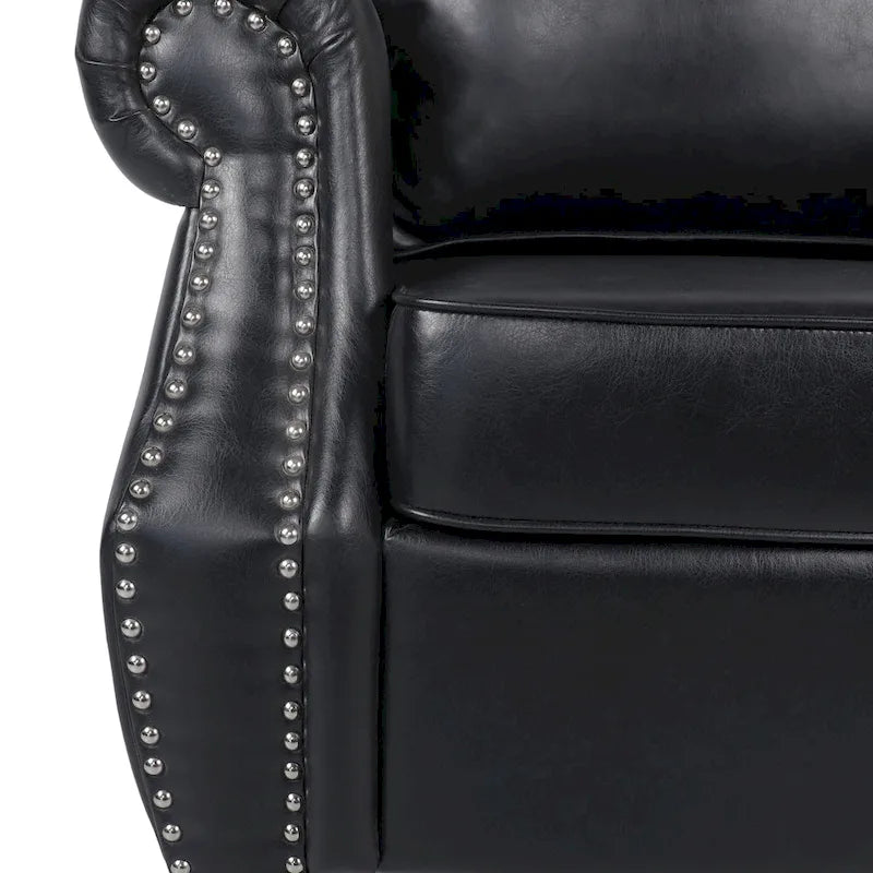 Fauteuil club en similicuir marron cognac avec cloutage et accoudoirs roulés