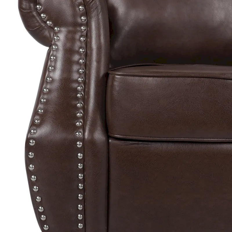 Fauteuil club en similicuir marron cognac avec cloutage et accoudoirs roulés
