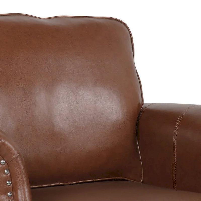 Fauteuil club en similicuir marron cognac avec cloutage et accoudoirs roulés