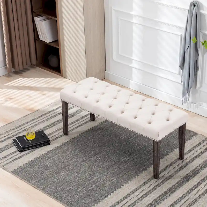 Banc capitonné en velours avec clous décoratifs et pieds en bois