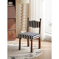 Chaise de salle à manger tapissée à rayures noires et blanches avec pieds tournés en bois massif